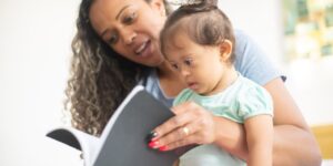 mom reads to a baby