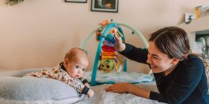 a baby and their mom during tummy time