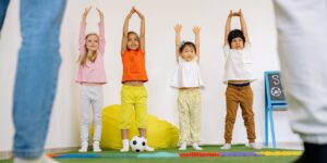 Kids stretching their arms